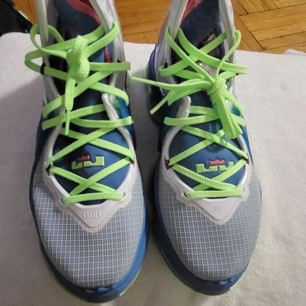 Elevate your basketball game with these Nike LeBron XIX sneakers in a vibrant Du